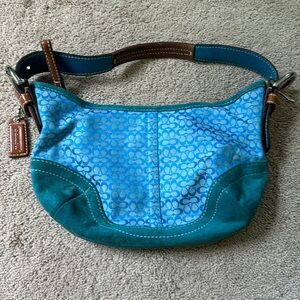 Small turquoise coach purse.